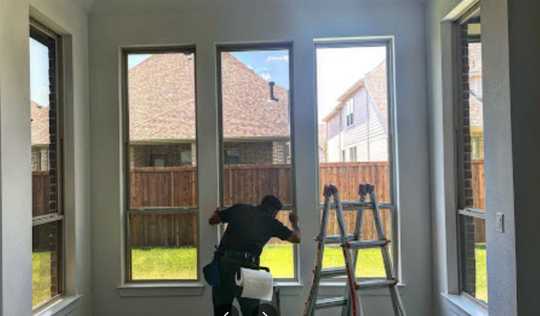 Image of Metro Tint Professional Installing a window film