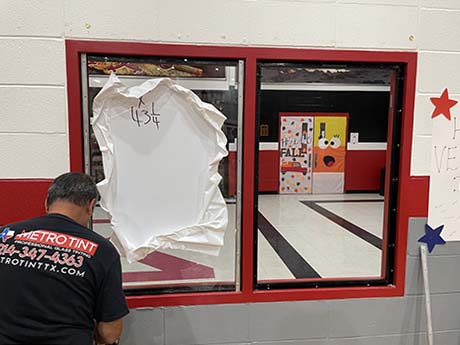 Riot Glass AP25 panels being installed for school safety by Metro Tint Texas, Texas' leading Riot Glass Installation company.